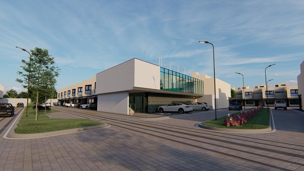 Acceso principal a Villas Zacango con áreas verdes y vialidad interior